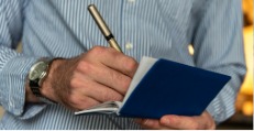 Man learning how to write a check
